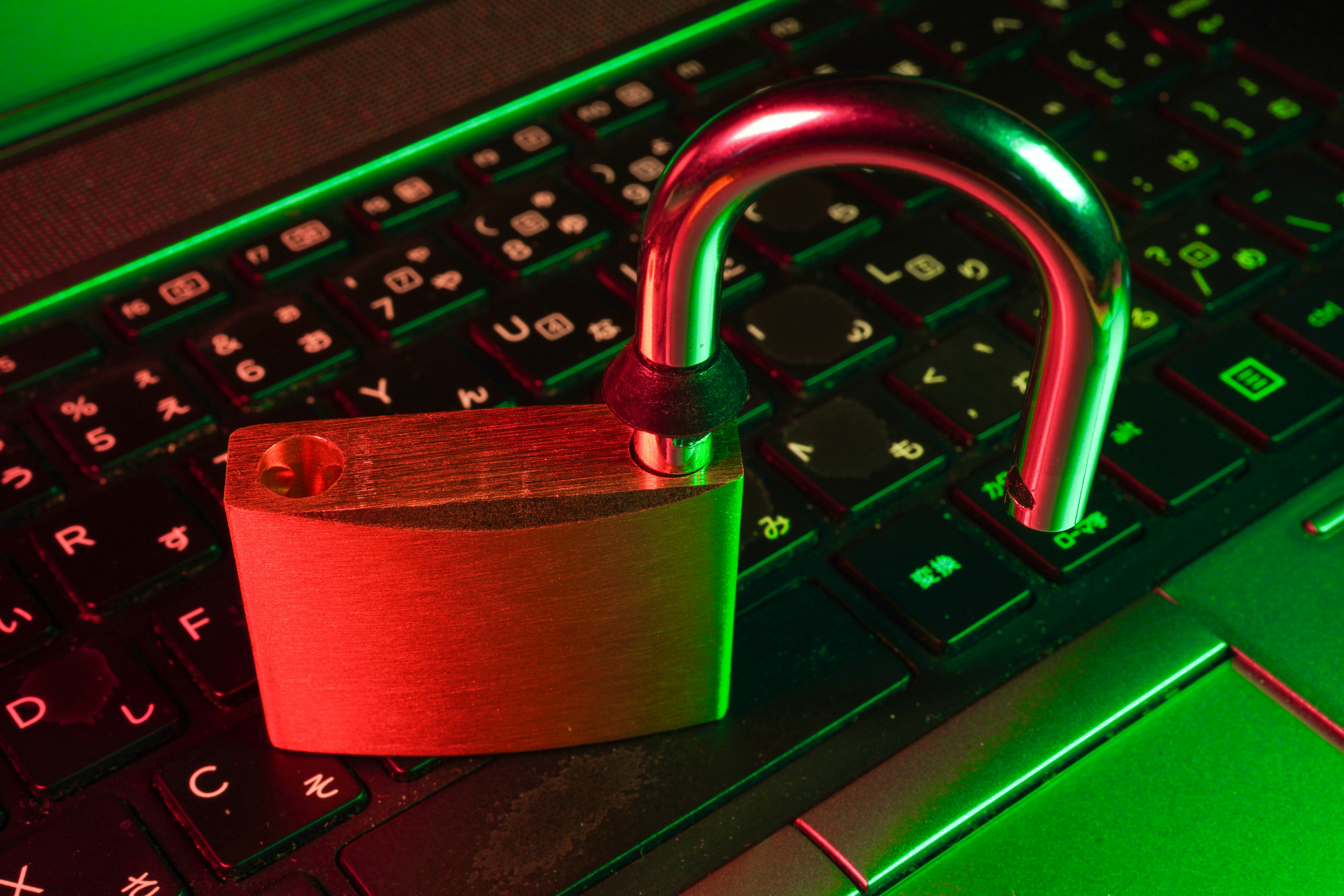 Cybersecurity scam warning image showing an open padlock on a computer keyboard, representing new scams targeting bookkeepers and accounting professionals.