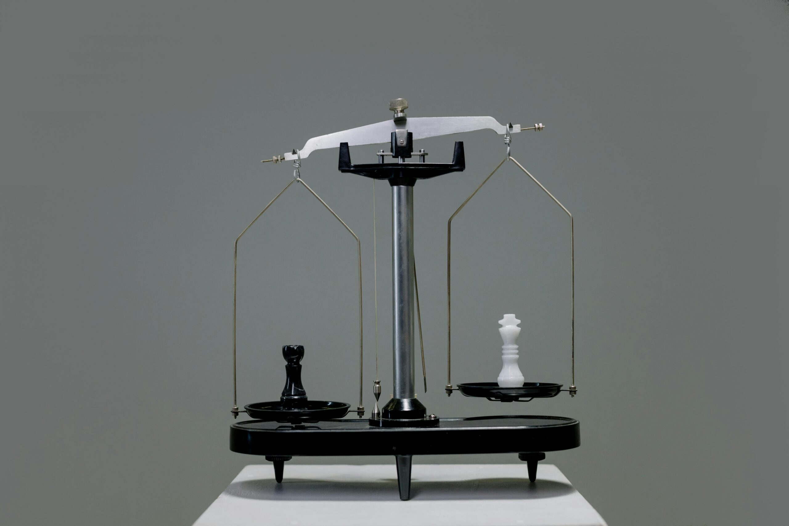 balance scale comparing value and cost in a strategic financial decision like hiring a fractional CFO