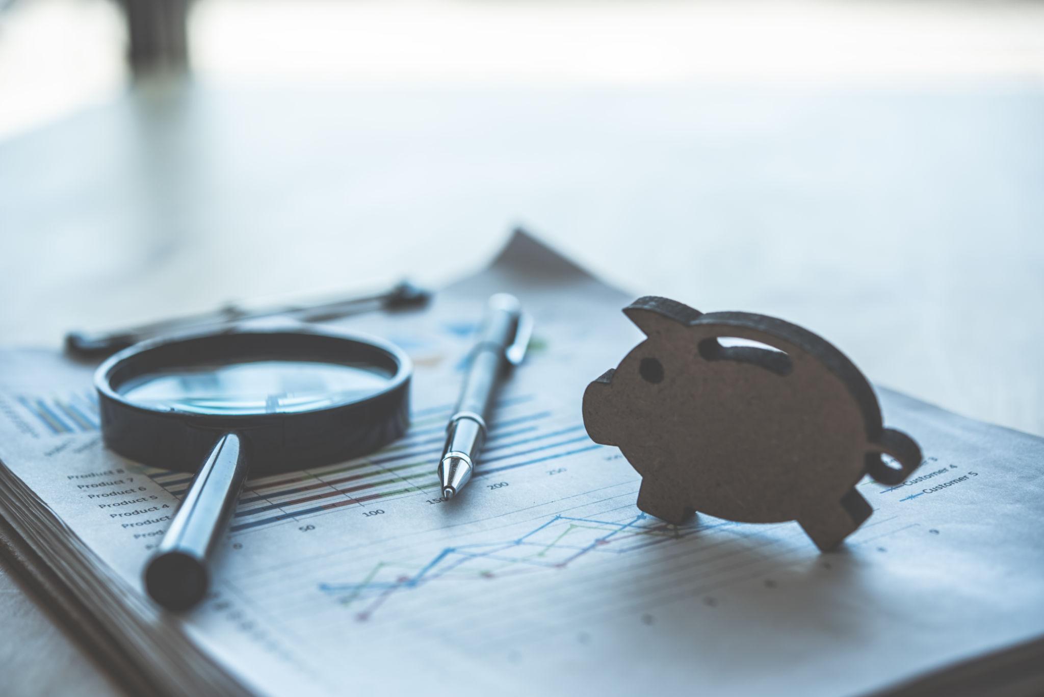 Financial reports, business performance charts, and cash flow analysis tools used to evaluate when a growing company should hire a fractional CFO.